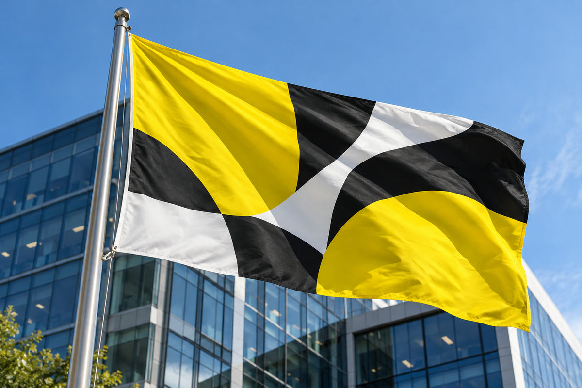 Custom flag on a flagpole by an office building