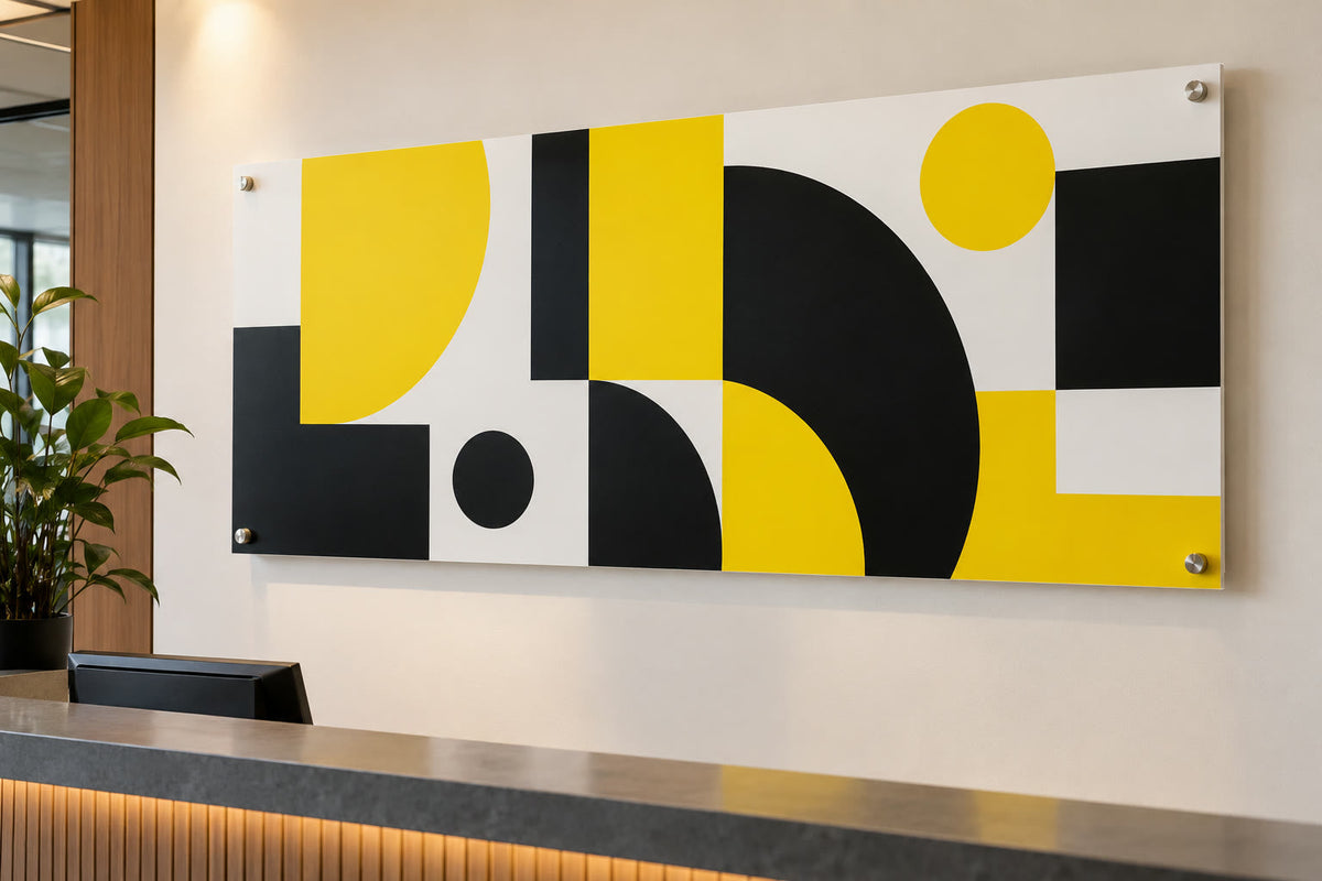Custom PVC sign mounted with standoffs in an office lobby